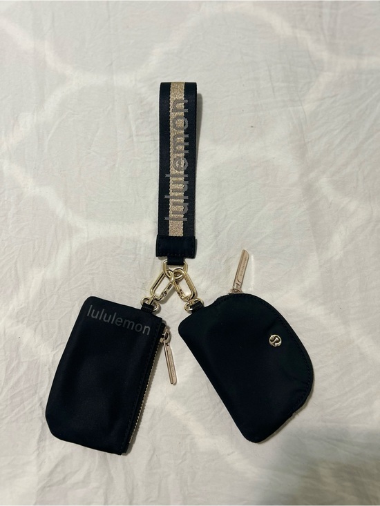 lululemon athletica Handbags - lululemon athletica Black and Gold Wristlet Key Pouch Set